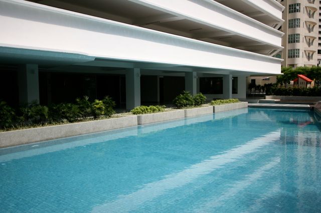 Swimming pool beside the apartment tower